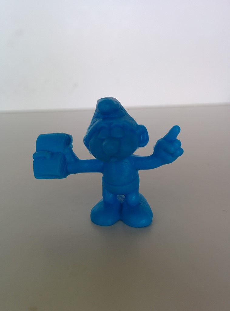 OMO mini - Schtroumpf avec un livre