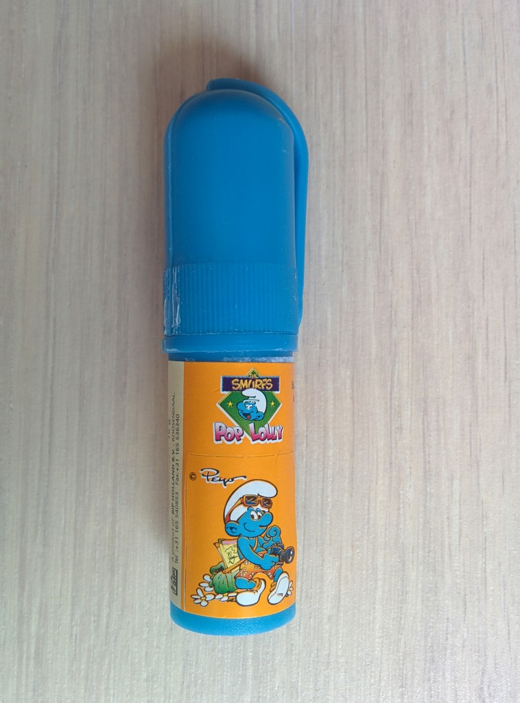 Sucette avec autocollant Schtroumpf photographe