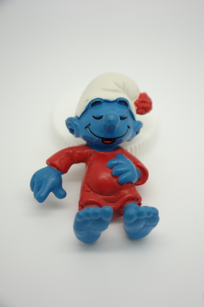 Schtroumpf dormeur dans son lit