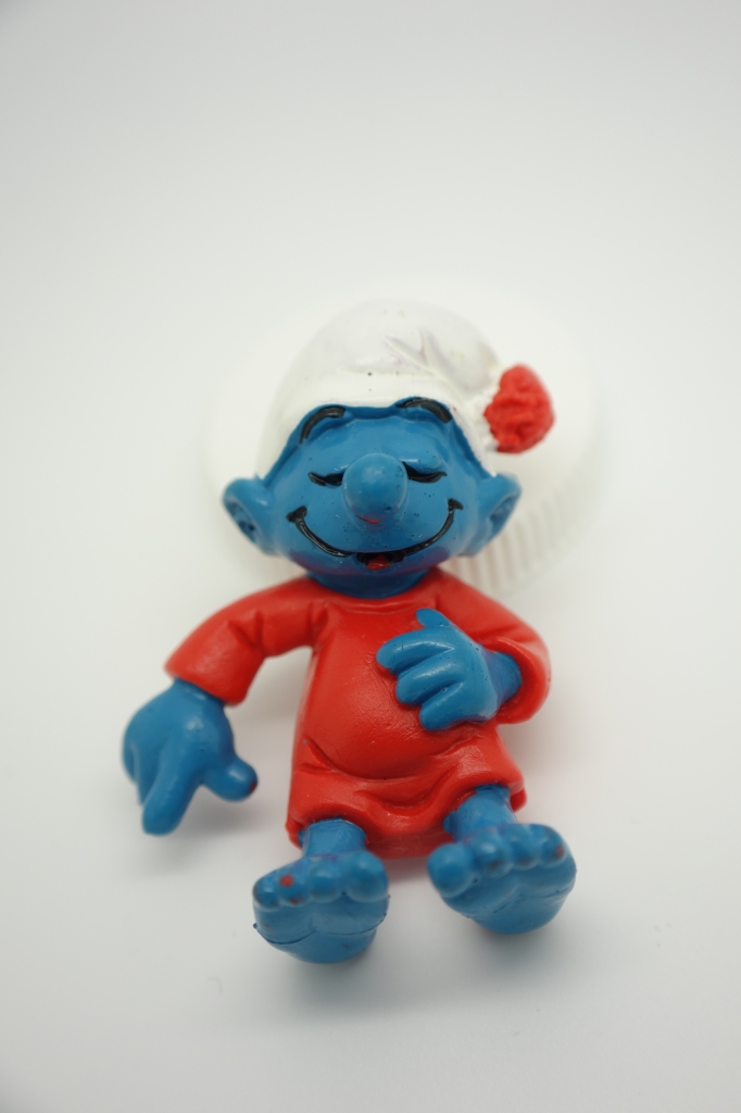 Schtroumpf dormeur dans son lit