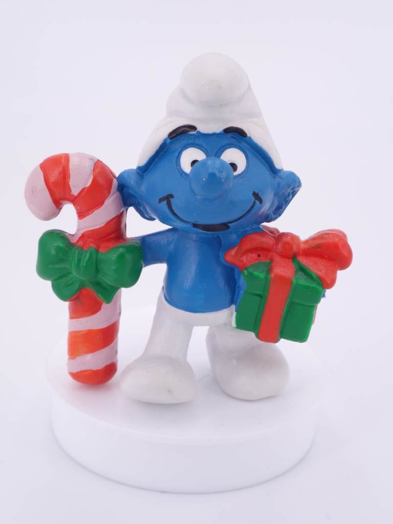Schtroumpf de Noël avec cadeau et sucre d'orge