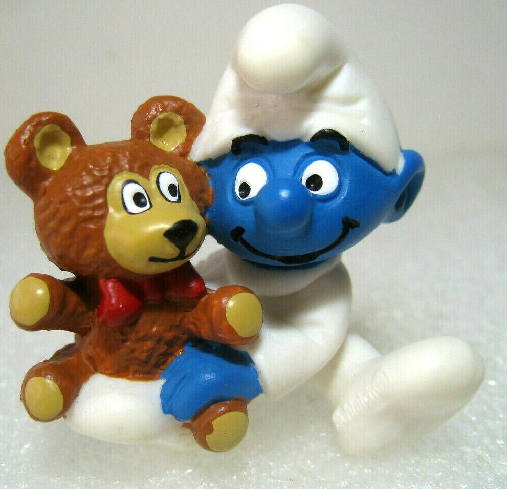 Bébé Schtroumpf avec ourson en peluche