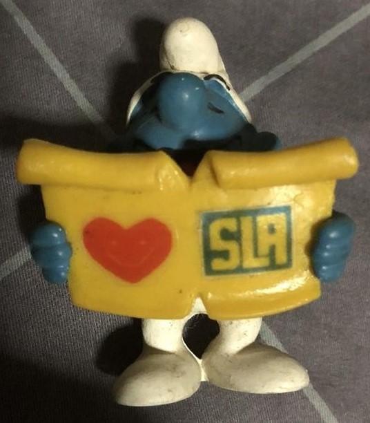 Schtroumpf chanteur avec partition