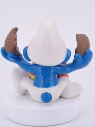 Schtroumpf qui mange un œuf au chocolat - photo