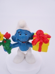 Schtroumpf avec cadeau et fleurs - photo