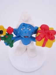 Schtroumpf avec cadeau et fleurs - photo