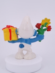 Schtroumpf avec cadeau et fleurs - photo