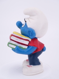 Schtroumpf étudiant avec pile de livres - photo