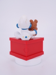 Bébé Schtroumpf avec ourson en peluche - photo