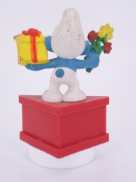 Schtroumpf avec cadeau et fleurs - photo