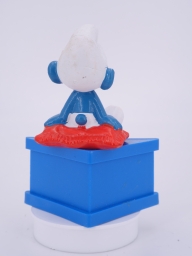 Schtroumpf assis sur un coussin - photo