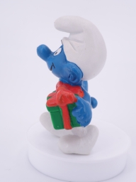 Schtroumpf de Noël avec cadeau et sucre d'orge - photo