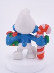 Schtroumpf de Noël avec cadeau et sucre d'orge - photo