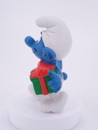 Schtroumpf de Noël avec cadeau et sucre d'orge - photo