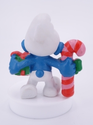 Schtroumpf de Noël avec cadeau et sucre d'orge - photo