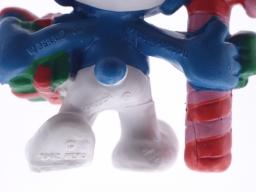 Schtroumpf de Noël avec cadeau et sucre d'orge - photo