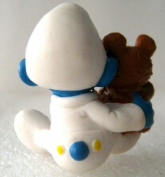 Bébé Schtroumpf avec ourson en peluche - photo