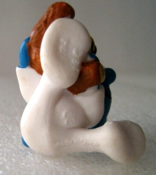 Bébé Schtroumpf avec ourson en peluche - photo