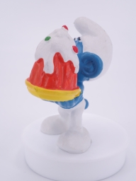 Schtroumpf gourmand avec gâteau - photo