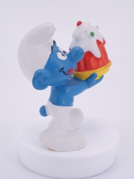 Schtroumpf gourmand avec gâteau - photo