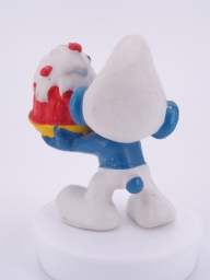 Schtroumpf gourmand avec gâteau - photo