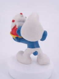 Schtroumpf gourmand avec gâteau - photo