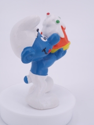 Schtroumpf gourmand avec gâteau - photo