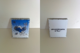 Fève timbre Schtroumpf volant