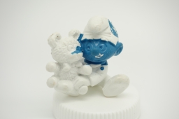 Bébé Schtroumpf avec ourson en peluche