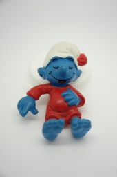 Schtroumpf dormeur dans son lit