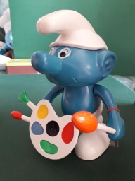 Tirelire Schtroumpf avec palette de peinture (peintre/artiste)