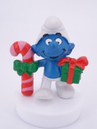 Schtroumpf de Noël avec cadeau et sucre d'orge