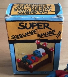 Schtroumpf dormeur dans son lit
