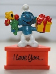 Schtroumpf avec cadeau et fleurs