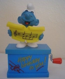 Schtroumpf chanteur avec partition