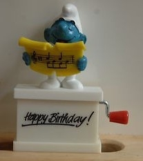 Schtroumpf chanteur avec partition