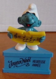 Schtroumpf chanteur avec partition