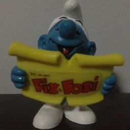 Schtroumpf chanteur avec partition